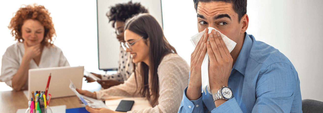 Man blowing nose